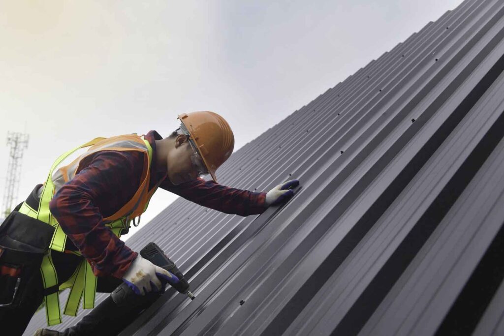 Commercial Roofer on a metal Roof South Florida