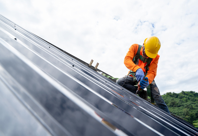 South Florida Roofer repairing a metal roof