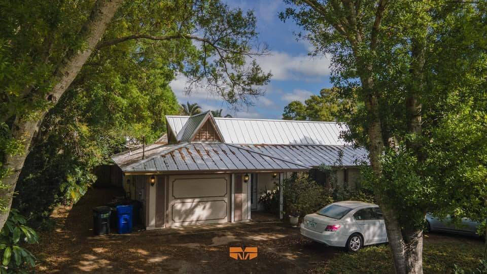 Metal Roof and retro 70s home in a residential port st lucie neighborhood