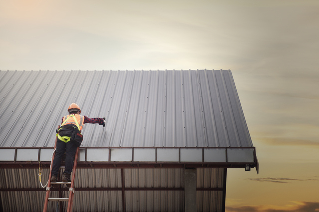 Commercial Roofer in Melbourne FL Repairing a Roof